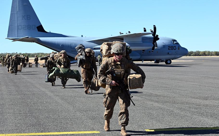 U.S. Marines on an airfield.