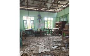 A damaged ceiling and debris all over the floor.