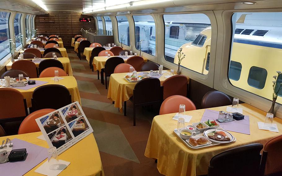 The dining car of an antique passenger train appears to be waiting for guests at SCMaglev and Railway Park Museum in Nagoya, Japan. 