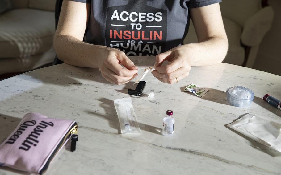 Lija Greenseid prepares to draw insulin at her home in St. Paul, Minn. More than 7 million Americans depend on insulin to keep their bodies functioning, according to the American Diabetes Association.