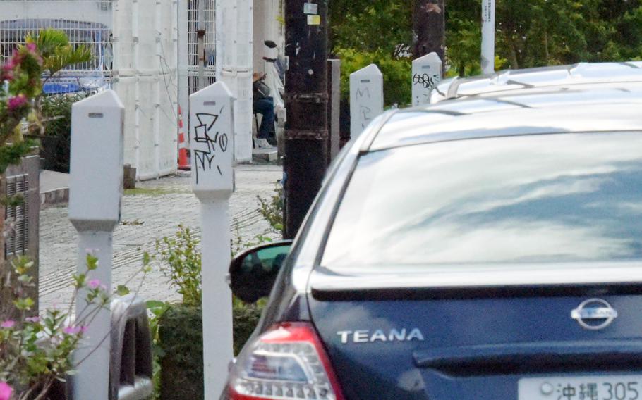 Cars park illegally beside closed meters in Okinawa City, Okinawa, Tuesday, April 26, 2022. 