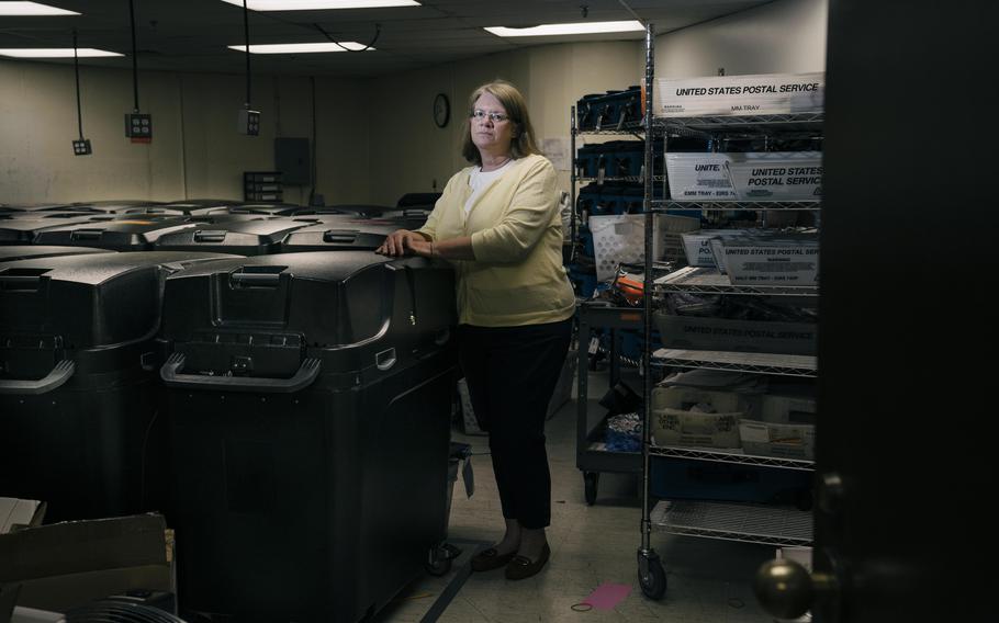 The threats and abuse are "too much," said City Clerk Susan Nash, pictured in a secure storage room for election equipment at city hall in Livonia, Mich. The room is kept locked and under video surveillance.