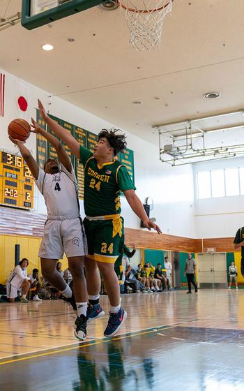 Zama's Ryan Pena puts up a shot while Robert D. Edgren's Jayse Ulechong defends.