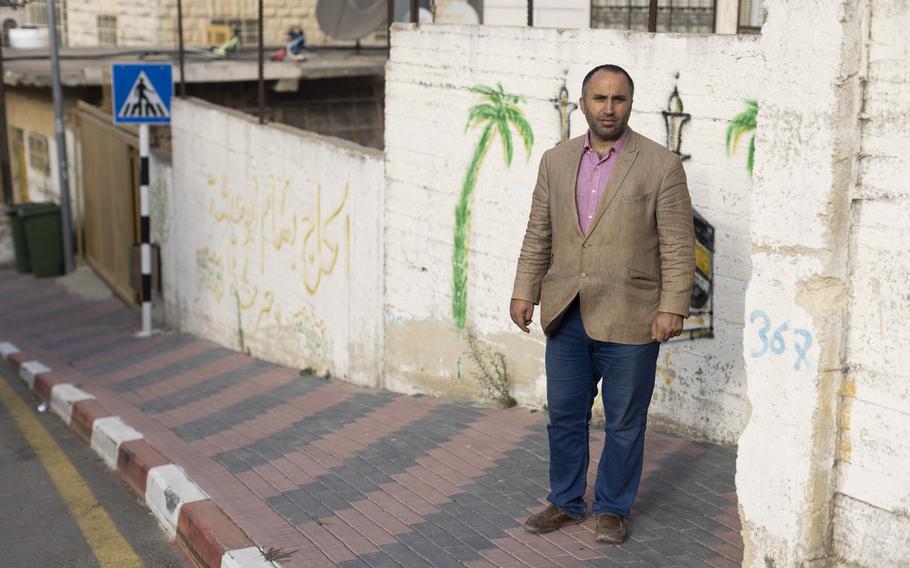 Issa Amro, seen in Hebron on Oct. 13, 2021, says Israel has ulterior motives for its surveillance of Palestinians. "They want to make our lives so hard so that we will just leave on our own, so more settlers can move in," he said. 