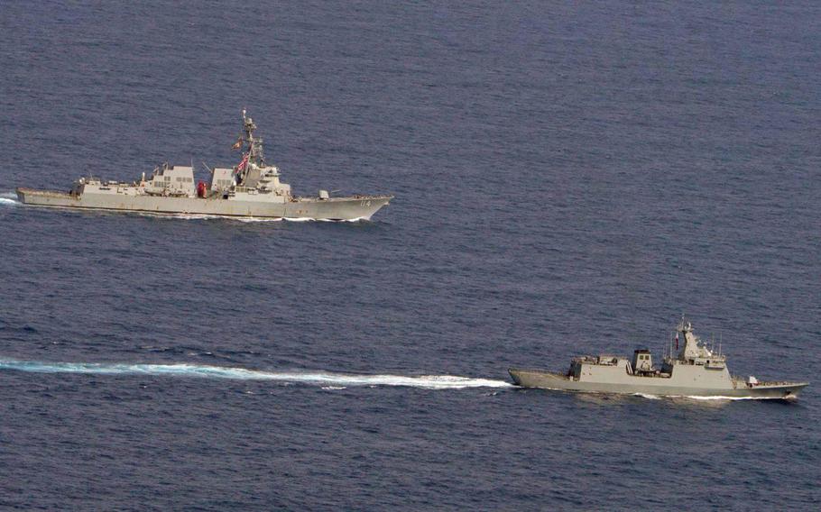 The guided-missile destroyers USS Ralph Johnson and BRP Jose Rizal steam through the South China Sea during a joint exercise, Monday, Sept. 4, 2023.