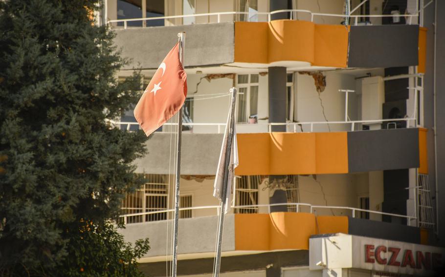 The balconies of an apartment building in Adana, Turkey, remain buckled and collapsed on Feb. 25, 2023, after earthquakes earlier in the month struck the region.