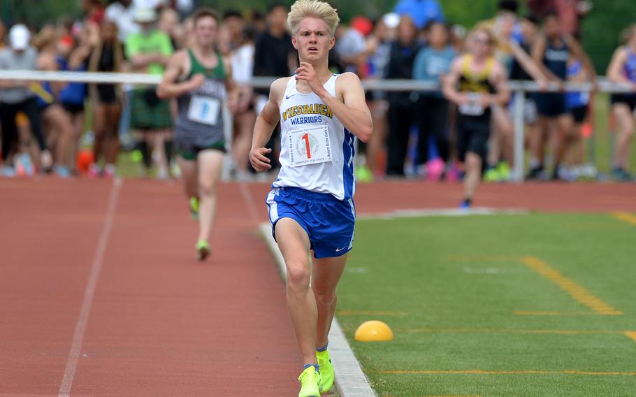 Wiesbaden’s Luke Jones heads down the home stretch in the boys 3,200-meter race, on his way to shattering the DODEA-Europe record in 9 minutes, 29.63 seconds at the European finals in Kaiserslautern, Germany, May 19, 2023.