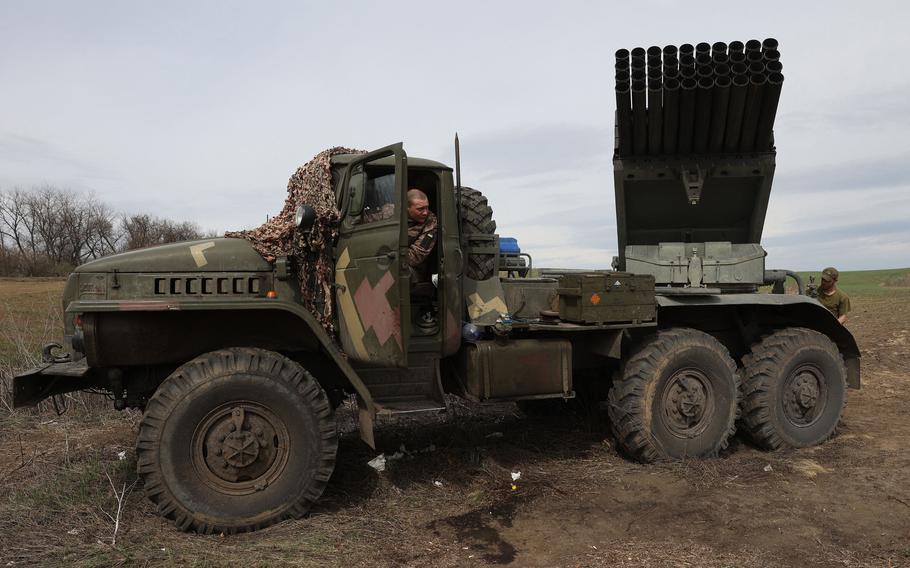 Ukrainian artillerymen prepare a multiple rocket launcher BM-21 "Grad" on the front line near Lugansk, in the Donbas region, on April 10, 2022.