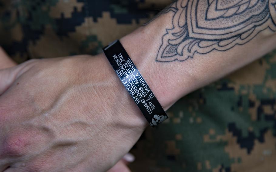 Marine Warrant Officer Sasha Savage wears a bracelet remembering Sgt. Nicole Gee at Camp Lejeune in North Carolina on July 18. 