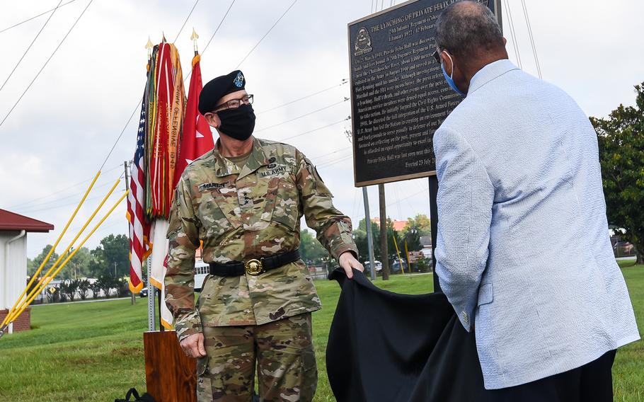 Rep. Sanford Bishop, D-Ga., right, and Army Lt. Gen. Ted Martin, the commander of the Army’s Combined Arms Center reveal a historical marker in remembrance of Pvt. Felix Hall at Fort Benning, Ga. on Tuesday, Aug. 3, 2021. In 1941, the 19-year-old Hall, a member of the Army’s Black-only 24th Infantry Regiment, was lynched on the Army post. He is the only known victim of a lynching on a U.S. military installation.