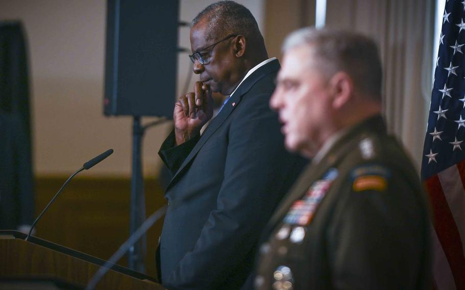 U.S. Defense Secretary Lloyd Austin, left, listens to U.S. Army Gen. Mark Milley during closing remarks at the Ukraine Defense Contact Group meeting Sept. 19, 2023, at Ramstein Air Base, Germany.