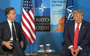 In this screenshot, NATO Secretary General Mark Rutte listens to President Donald Trump on June 25, 2025. Rutte and Trump made short remarks before the day's meetings at the NATO summit in The Hague, Netherlands, got underway.