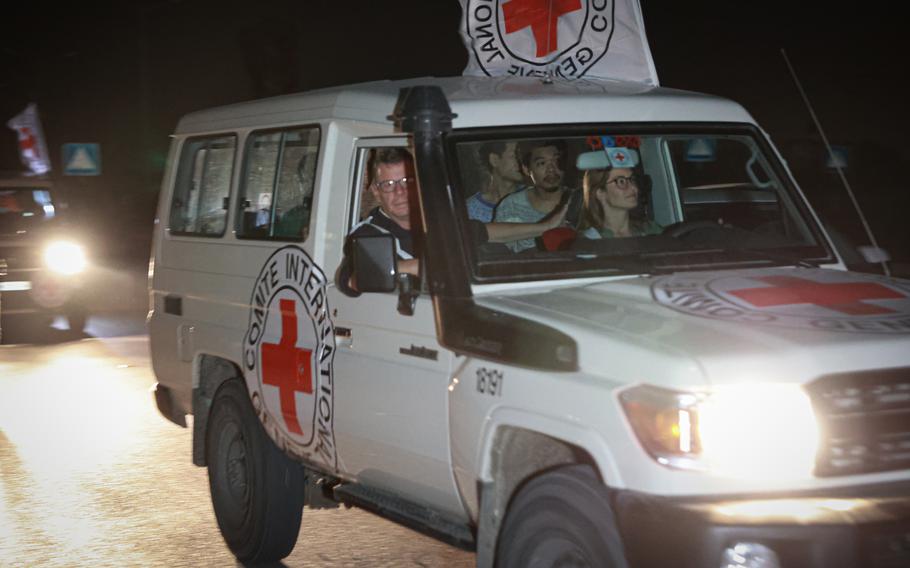 International Red Cross vehicles carrying hostages released by Hamas cross the Rafah border point in the Gaza Strip toward Egypt on Nov. 25, 2023.