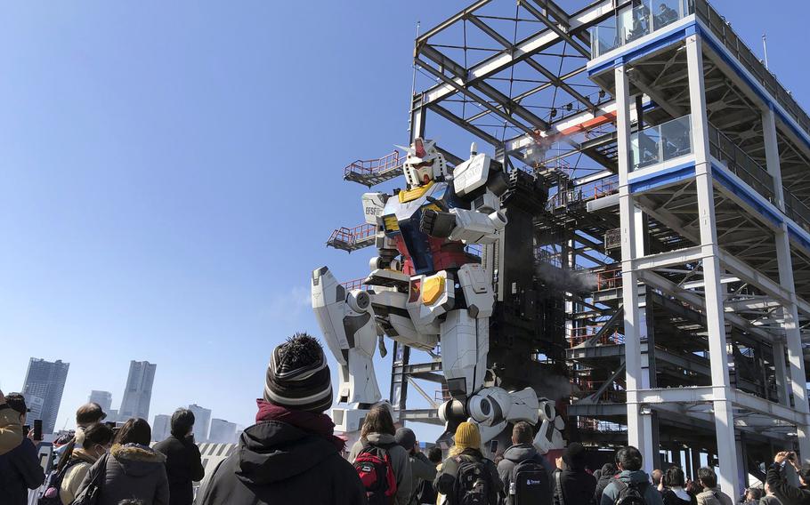 The nearly 60-foot RX-78F00 kneels for visitors at the Gundam Factory in Yokohama, Japan.