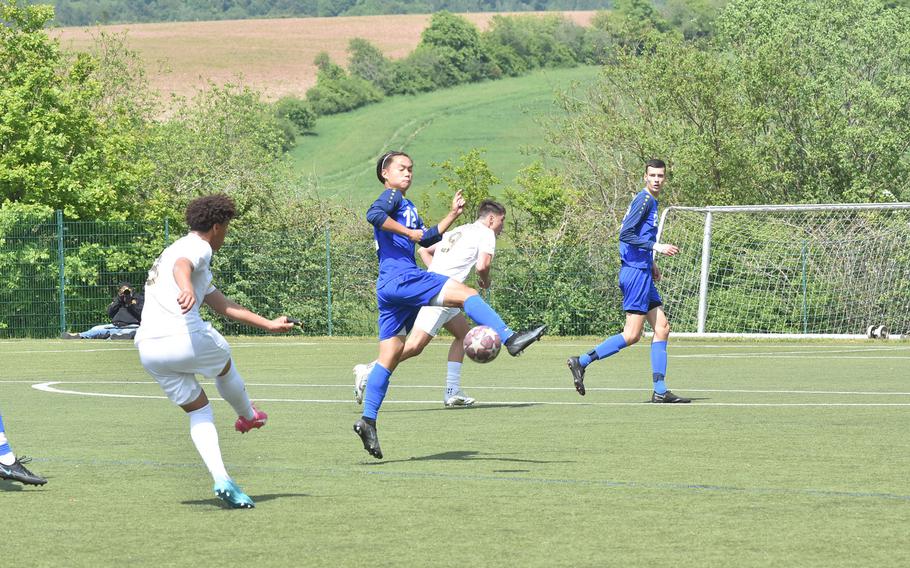 Wiesbaden's Noah Lee blocks a shot on goal from Ramstein's Maxim Speed in the semifinals of the DODEA-Europe Division boys semifinal Wednesday, May 17, 2023.