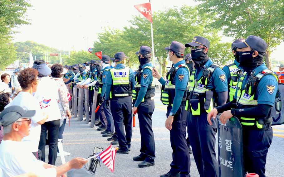 South Korean police block protesters on a road leading to Camp Humphreys, South Korea, Thursday, July 27, 2023. 
