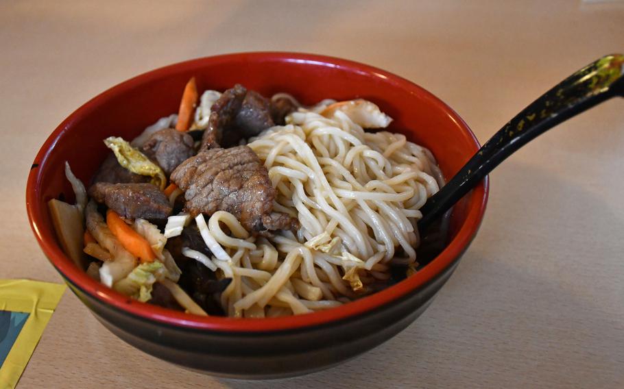Ramen topped with sliced beef and vegetables at Sakura Japanese and Chinese Restaurant in Lakenheath, England. 