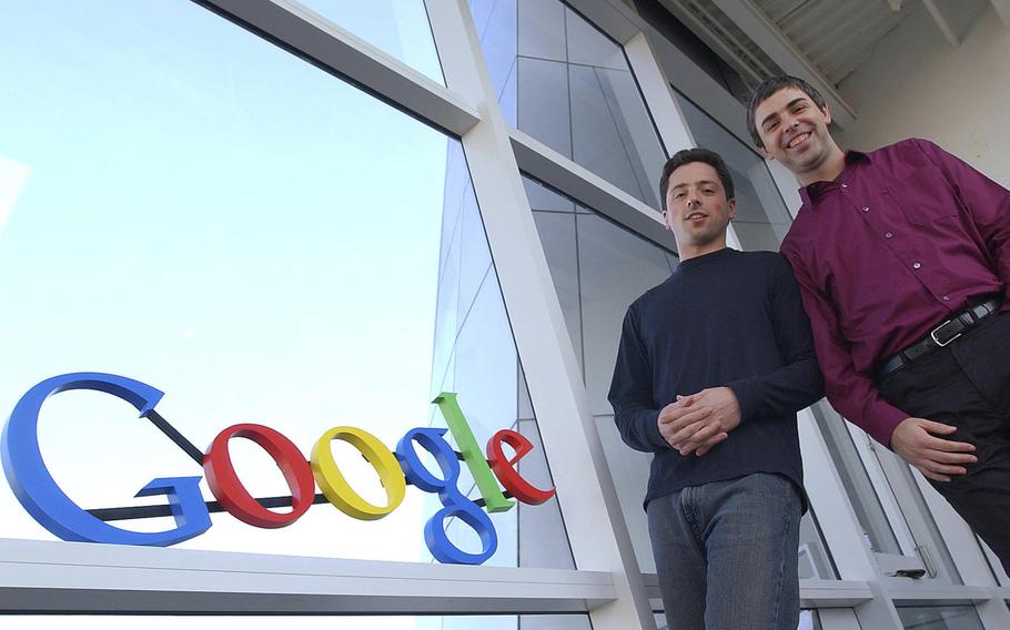 Google co-founders Sergey Brin, left, and Larry Page pose at company headquarters Jan. 15, 2004, in Mountain View, Calif. 