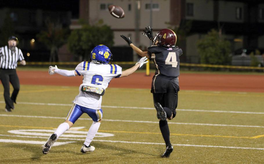 Matthew C. Perry's Jordan Burford tries to catch a pass in front of Yokota's William Rowell.