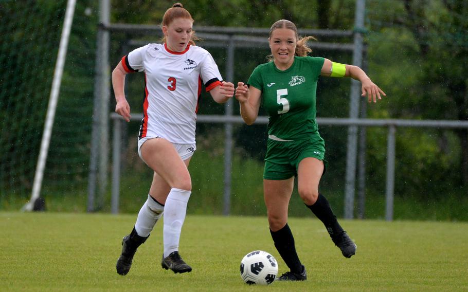 AOSR’s Gloria Olivieri and Naples’ Emma Heavey battle for the ball in a Division II game at the DODEA-Europe soccer finals at Reichenbach-Steegen, Germany, May 21, 2024. Naples defeated AOSR 6-0.