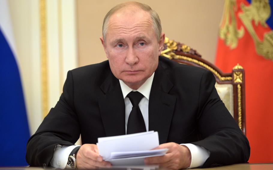 Russian President Vladimir Putin speaks during a meeting in Moscow, Russia, Sept. 9, 2021. The Kremlin says Russian President Vladimir Putin is going into self-isolation because of coronavirus cases among his inner circle. The announcement came Tuesday Sept. 14, 2021, in the Kremlin's readout of Putin's phone call with the Tajik President Emomali Rahmon. Putin has been fully vaccinated with the Russian coronavirus vaccine Sputnik V. He received his second shot in April.