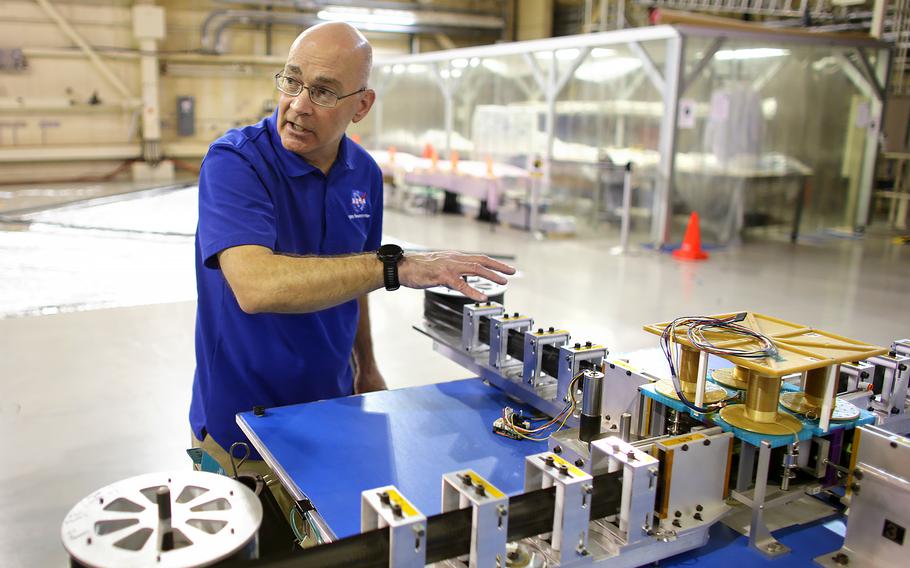 Jay Warren, chief engineer for the ACS3 sail boom subsystem, explains how the advanced composite solar sail system or ACS3’s frame unfolds during deployment Tuesday, April 16, 2024.