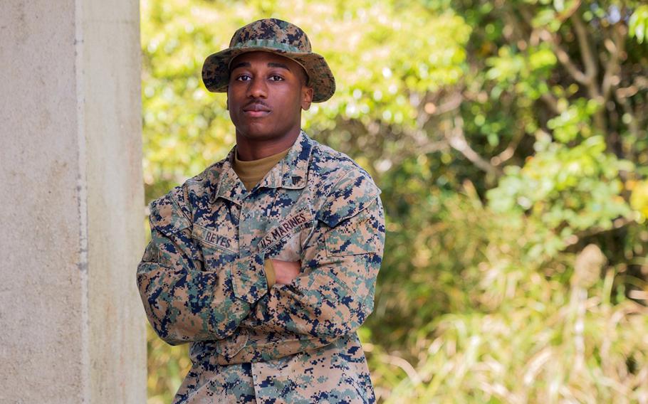 Marine Corps Cpl. Abel Reyes poses at the Jungle Warfare Training Center in northern Okinawa, March 20, 2024. 