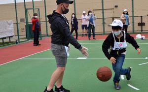 A student from a Tokyo-area school competes in the Kanto Plains Special Olympics at Yokota Air Base, Japan, Saturday, May 22, 2021. 