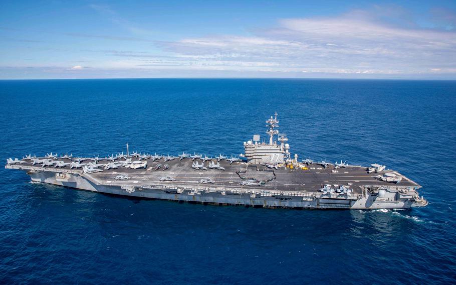 Sailors from Texas aboard the aircraft carrier USS George H.W. Bush form an outline of their home state on the flight deck, March 7, 2023. Actor Tom Cruise was reportedly aboard the Bush off the coast of Italy, where he was filming scenes for Mission: Impossible  Dead Reckoning Part Two."