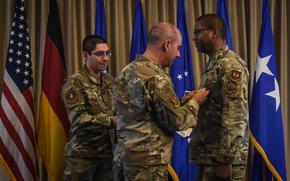 Gen. Jeffrey Harrigian, commander of U.S. Air Forces in Europe – Air Forces Africa, pins the Distinguished Service Medal on Maj. Gen. Randall Reed at Reed’s relinquishment of command ceremony on Wednesday, May 18, 2022, at Ramstein Air Base, Germany. 
