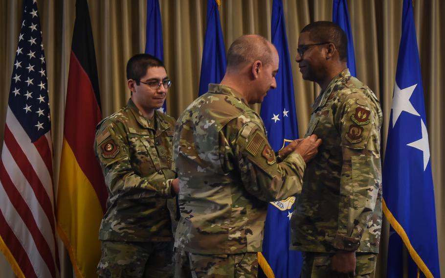 Gen. Jeffrey Harrigian, commander of U.S. Air Forces in Europe – Air Forces Africa, pins the Distinguished Service Medal on Maj. Gen. Randall Reed at Reed’s relinquishment of command ceremony on Wednesday, May 18, 2022, at Ramstein Air Base, Germany. 