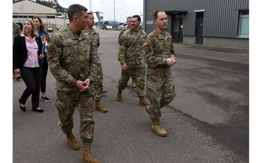 Maj. Gen. John Klein, left, commander of the Air Force Expeditionary Center, visits with airmen of the 521st Air Mobility Operations Wing at Ramstein Air Base in Germany on Feb. 23, 2023. A small team from Europe will participate in a large-scale mobility exercise this summer in the Pacific theater.