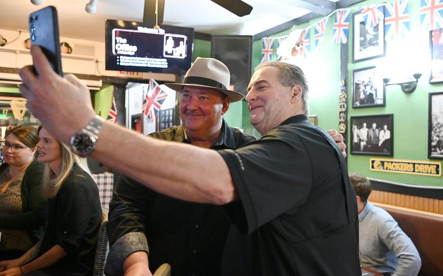 “The Office”s Brian Baumgartner takes a selfie with a fan at a CharityBuzz trivia night in Woodland Hills, Calif.