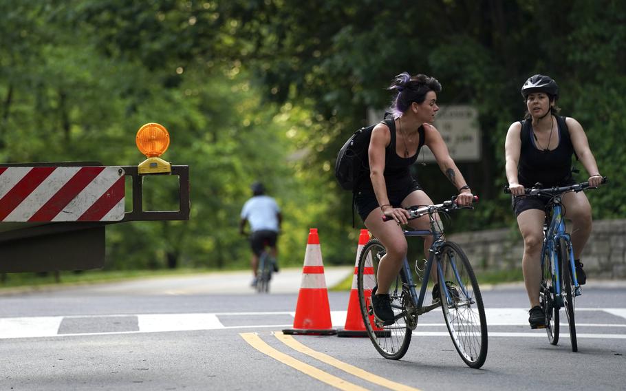 Cyclists in Washington D.C. enjoy a stretch of Beach Drive that is closed to vehicle traffic. 