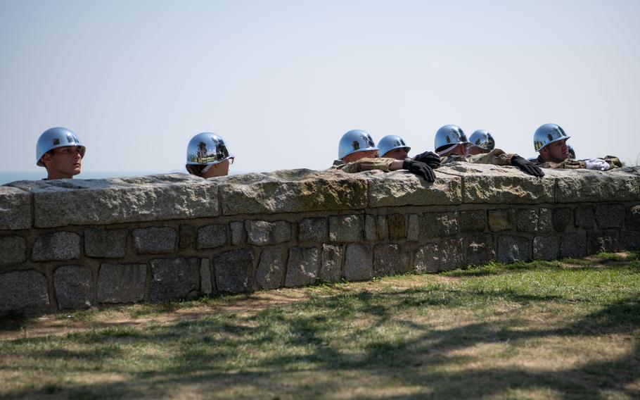 Soldiers with the 529th Military Police Company (Honor Guard) wait to perform a 21-gun salute at Normandy American Cemetery, June 6, 2024. 