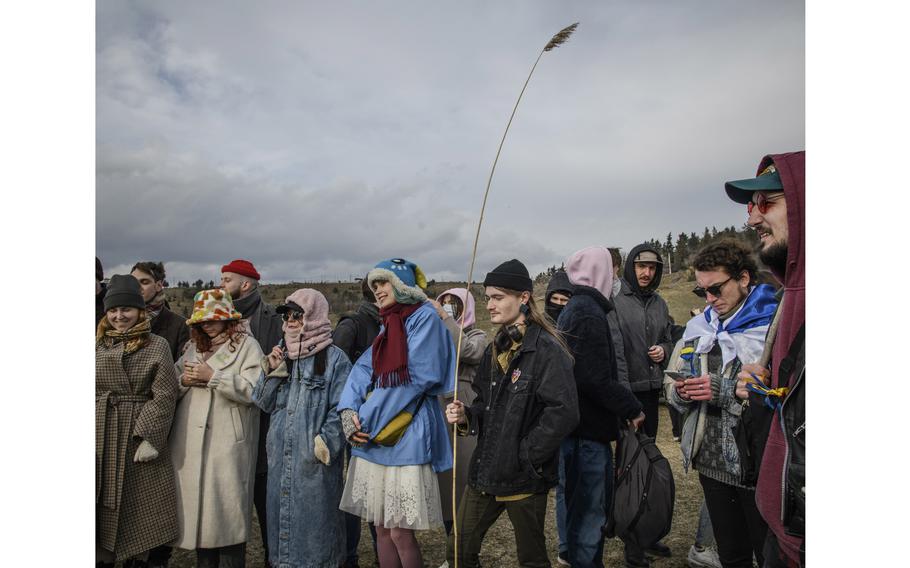 Russian, Belarussian and some Ukrainian youth gather at Tbilisi sea to participate at burning the doll of Russian president Vladimir Putin doll as a part of pagan rituals marking end of winter season and beginning of spring in Tbilisi, Georgia, on March 27, 2022. 