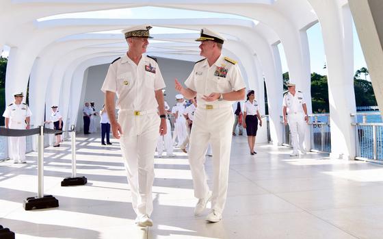 U.S. Pacific Fleet Commander Adm. Samual Paparo, right, speaks with French Air Force Lt. Gen. Vincent Cousin, commander of air defense and air operations, during a recent visit to the USS Arizona Memorial in Hawaii.