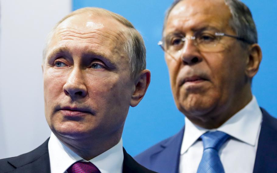 Russian President Vladimir Putin, left, and Foreign Minister Sergey Lavrov stand while waiting for Turkish President Recep Tayyip Erdogan prior to their talks at the G-20 summit in Hamburg, northern Germany,  July 8, 2017. In his role for nearly 18 years, Lavrov, 71, has seen relations with the West shift from near-friendly to openly hostile, plummeting to a catastrophic new low with the Russian war against Ukraine. The invasion prompted the European Union to freeze the assets of both Putin and Lavrov, among others — an unprecedented blow to Moscow’s pride. 