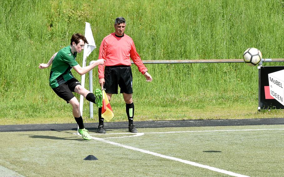 Naples forward Jackson Shorey sends in a corner during a Division II semifinal against Marymount at the DODEA European soccer championships on May 17, 2023, at VfR Baumholder's stadium in Baumholder, Germany.