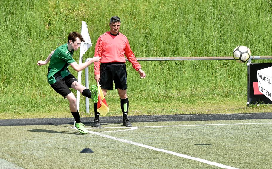 Naples forward Jackson Shorey sends in a corner during a Division II semifinal against Marymount at the DODEA European soccer championships on May 17, 2023, at VfR Baumholder's stadium in Baumholder, Germany.