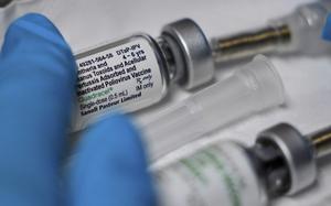A vaccination that includes a polio dose is prepared for a child at the Dallas County Health and Human Services immunization clinic in Dallas, Friday, April 4, 2025. (AP Photo/LM Otero)