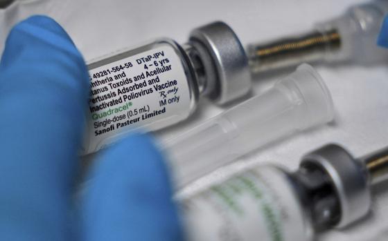 A vaccination that includes a polio dose is prepared for a child at the Dallas County Health and Human Services immunization clinic in Dallas, Friday, April 4, 2025. (AP Photo/LM Otero)