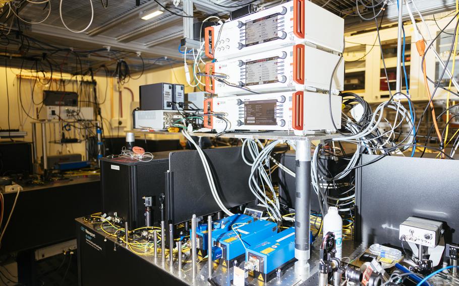 Laser heads, bottom, and laser controllers, top, at the quantum computing lab at the University of Chicago's Eckhardt Research Center on Oct. 4, 2022. 