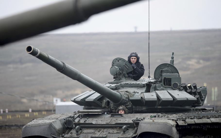 Russian troops take part in drills at the Kadamovskiy firing range in the Rostov region in southern Russia, Dec. 14, 2021.