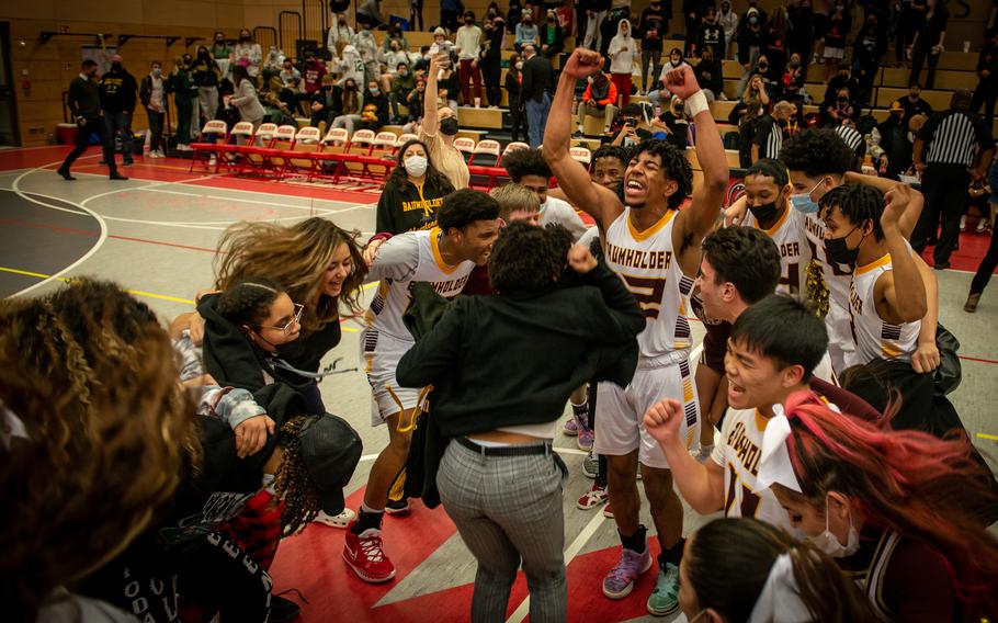 Baumholder Buccaneers celebrate their win at the DODEA-Europe Division III boys basketball title game in Kaiserslautern, Germany, on Saturday, Feb. 26, 2022.