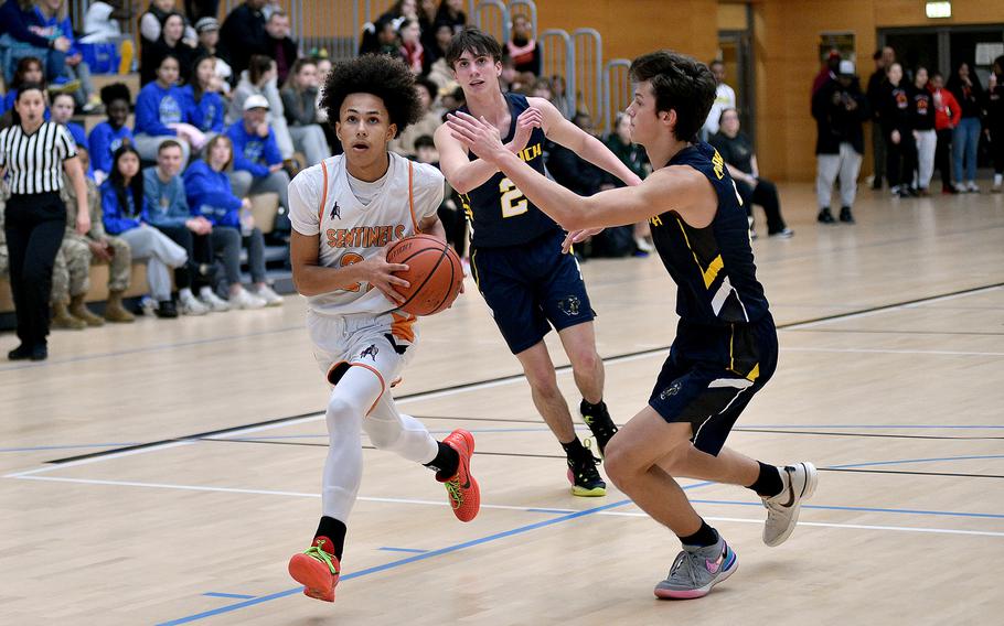 Spangdahlem sophomore Cameron Lewis drives to the bucket as Ansbach sophomore Ethan Dixon defends during pool-play of the DODEA European Basketball Championships on Feb. 14, 2024, at the Wiesbaden Sports and Fitness Center on Clay Kaserne in Wiesbaden, Germany.