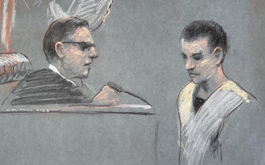 This artist depiction shows Massachusetts Air National Guardsman Jack Teixeira, right, appearing in U.S. District Court in Boston, April 14, 2023. A judge is poised to decide whether the Massachusetts Air National Guard members accused of leaking highly classified military documents will remain behind bars while he awaits trial. 