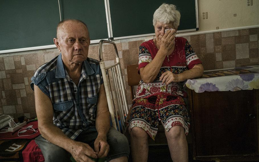 Serbin Fedok, 70, left, and Valentina Yefimenko, 66, now live in the city of Kryvyi Rih, in a shelter for Ukrainians displaced by the war. 