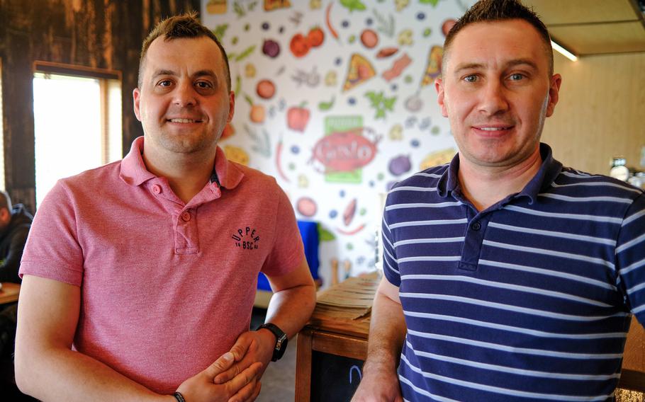 Damian Drupka, left, and Rafal Kramarz at Pizzeria Gusto, a restaurant they own together, which has became popular with U.S. troops deployed to southeast Poland. 