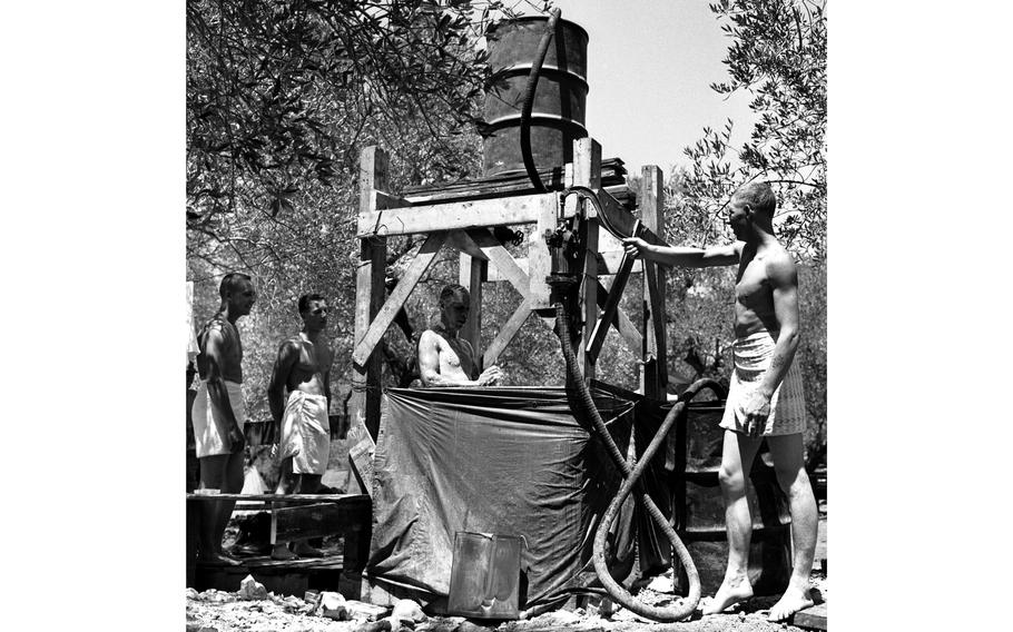 Thanks to typical American ingenuity, soldiers from the 1st Airborne Battle Group, 187th Infantry's supply and transportation platoon were able to enjoy a nice shower during Operation Blue Bat, a mission to back the beleaguered Lebanese government.